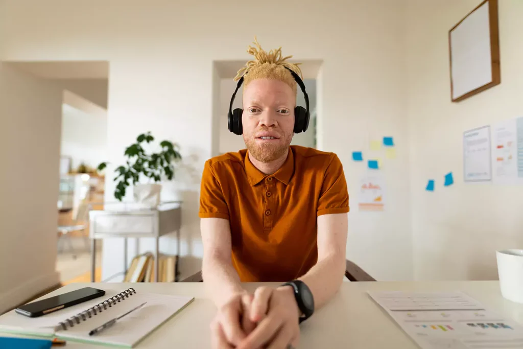 A disabled man wearing his headphones