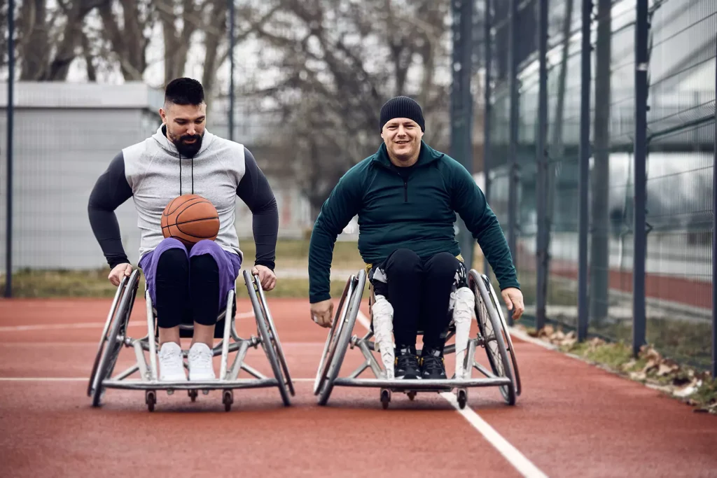 Two disabled men in their wheelchair playing basketball